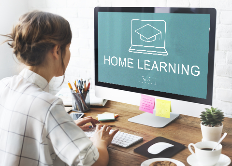 A female student learning science at home using a computer